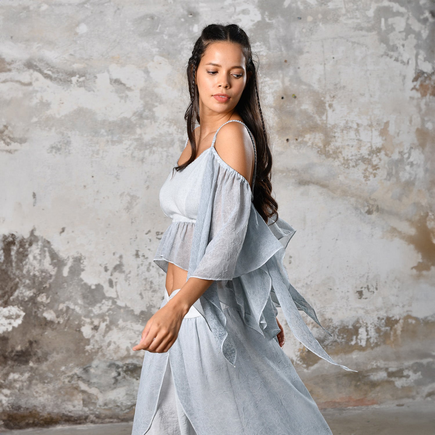 Introducing our Off-Shoulder Blue Boho Top, a symbol of effortless charm and Bohemian elegance. Crafted with an off-shoulder design, this top exudes a chic and relaxed vibe, perfect for the modern free spirit. In a serene baby blue hue, it adds a touch of ethereal beauty to any ensemble. Made from organic materials, it's a testament to sustainable fashion for the conscious woman. Embrace your inner goddess with this Gypsy-inspired piece, ideal for adding a Boho flair to your wardrobe.