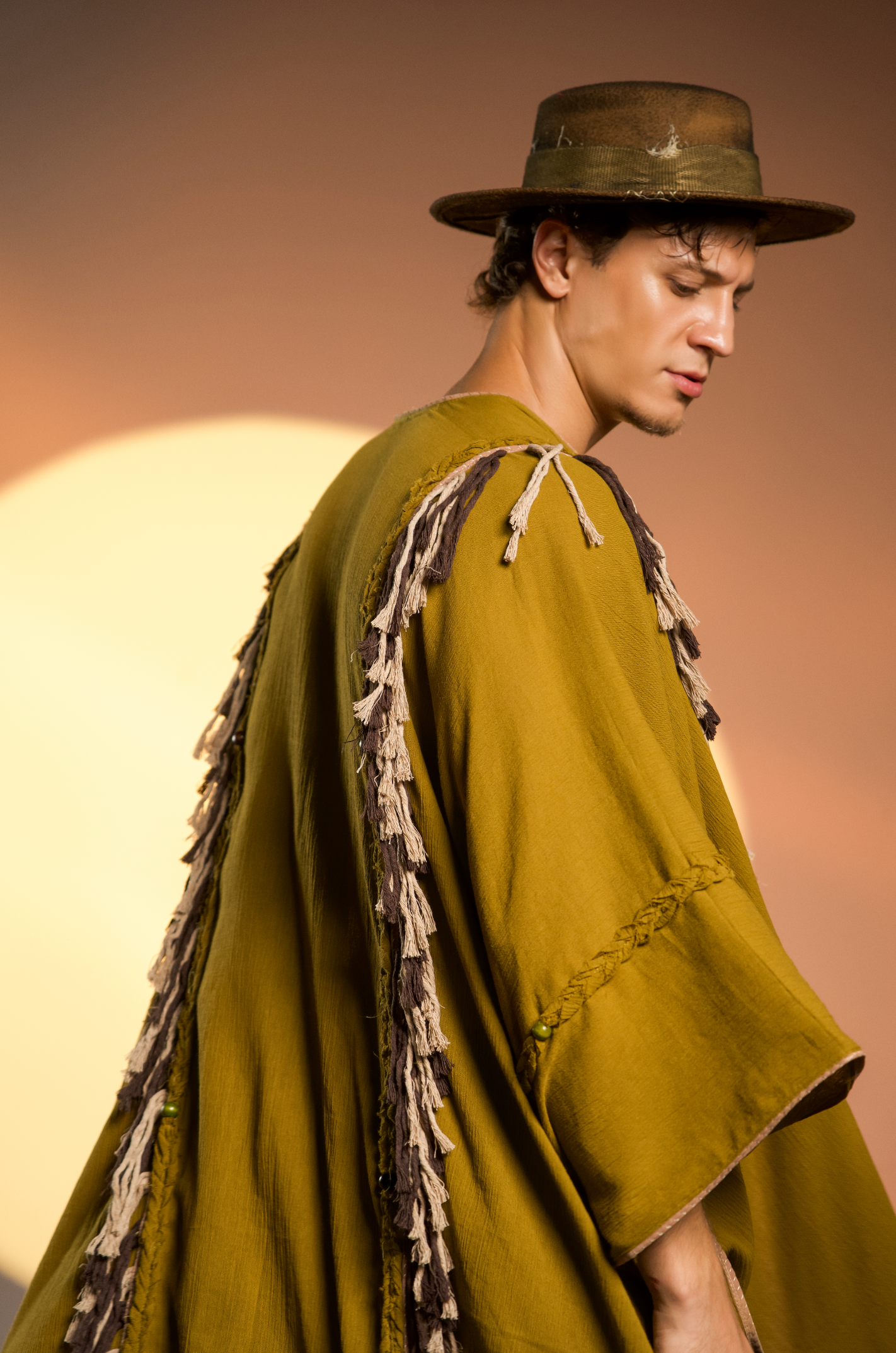 Bohemian bridal shawl in brown, crafted from organic cotton with fringe and tassels, ideal for casual wear or gypsy-inspired fashion.