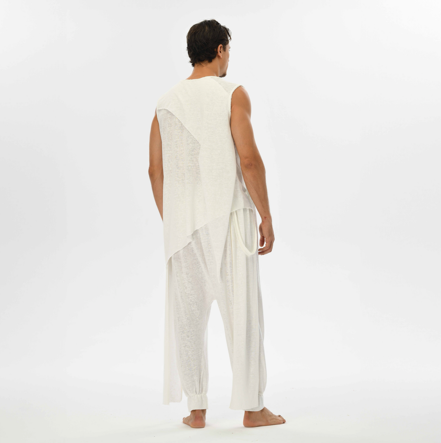 Boho chic men’s harem pants in white, made from breathable linen-cotton blend, ideal for lounging or festival wear.