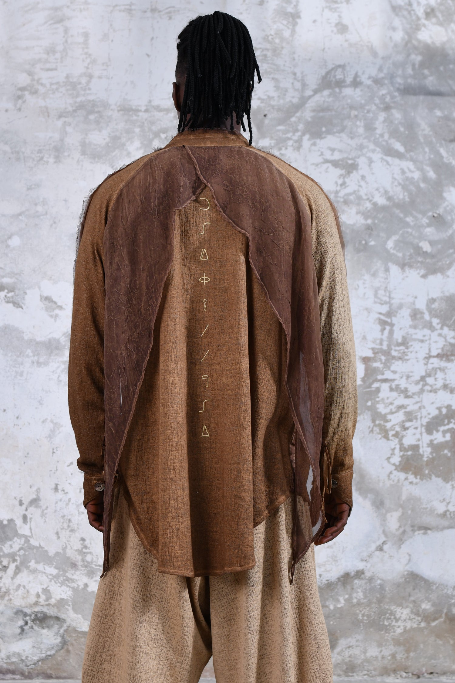 Sand boho men's shirt with alchemy and warrior designs, unique spiritual men's shirt made from soft cotton fabric, conscious clothing for men featuring cruelty-free materials, handcrafted bohemian-style men's shirt with chakra symbols, sustainable men's fashion, men's alchemist warrior shirt with chakra-inspired designs, mindful men's shirt made with eco-friendly materials, comfortable and stylish men's shirt with a spiritual touch, ethical and sustainable men's clothing with unique designs.