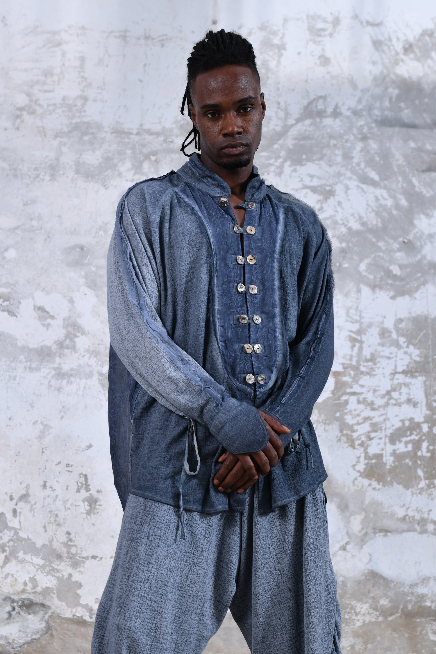 Blue boho men's shirt with alchemy and warrior designs, unique spiritual men's shirt made from soft cotton fabric, conscious clothing for men featuring cruelty-free materials, handcrafted bohemian-style men's shirt with chakra symbols, sustainable men's fashion, men's alchemist warrior shirt with chakra-inspired designs, mindful men's shirt made with eco-friendly materials, comfortable and stylish men's shirt with a spiritual touch, ethical and sustainable men's clothing with unique designs.