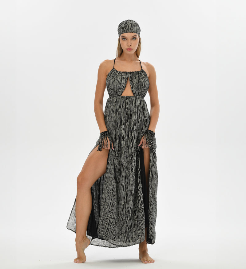 Elegant boho dress in black and white, crafted from handwoven cotton with raw texture. Perfect as a wedding guest or boho cocktail dress, with eco-friendly materials and a non-transparent design.