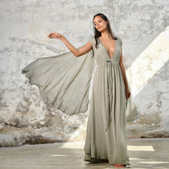 An enchanting Sage Green Greek Goddess Dress, perfect for any occasion. This elegant maxi dress features a flattering open back design, making it an ideal choice for a wedding guest or a bohemian-inspired event. The flowing, ethereal fabric and delicate details embody the essence of a Bohemian Gypsy Maxi Dress, exuding a Boho Sexy Elegant vibe.