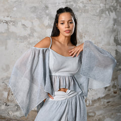 An enchanting Bohemian Venus BLUE, perfect for boho and festival-inspired looks, exuding a goddess-like quality. The flowy fabric and intricate side details create an ethereal, bohemian style perfect for Burning Man and other occasions. This garment is an ethically crafted gem