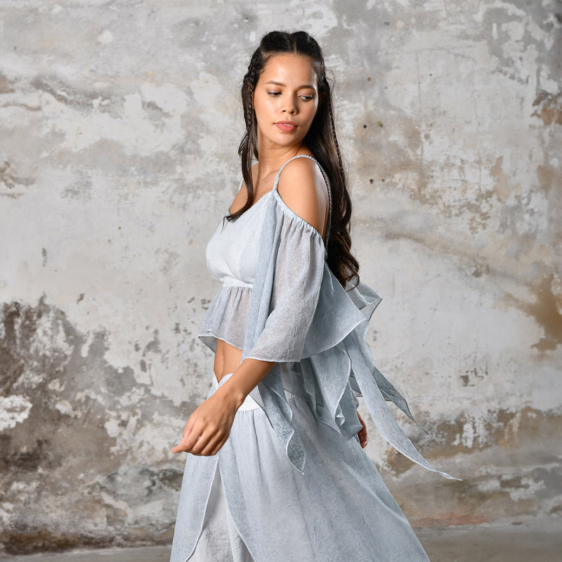  Introducing our Off-Shoulder Blue Boho Top, a symbol of effortless charm and Bohemian elegance. Crafted with an off-shoulder design, this top exudes a chic and relaxed vibe, perfect for the modern free spirit. In a serene baby blue hue, it adds a touch of ethereal beauty to any ensemble. Made from organic materials, it's a testament to sustainable fashion for the conscious woman. Embrace your inner goddess with this Gypsy-inspired piece, ideal for adding a Boho flair to your wardrobe.