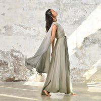 An enchanting Sage Green Greek Goddess Dress, perfect for any occasion. This elegant maxi dress features a flattering open back design, making it an ideal choice for a wedding guest or a bohemian-inspired event. The flowing, ethereal fabric and delicate details embody the essence of a Bohemian Gypsy Maxi Dress, exuding a Boho Sexy Elegant vibe.