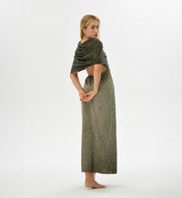 Warrior-inspired khaki green dress with an open back, high side splits, and a hood that transforms into a shawl. Made from a hand-dyed cotton and linen blend, ideal for festival fashion.