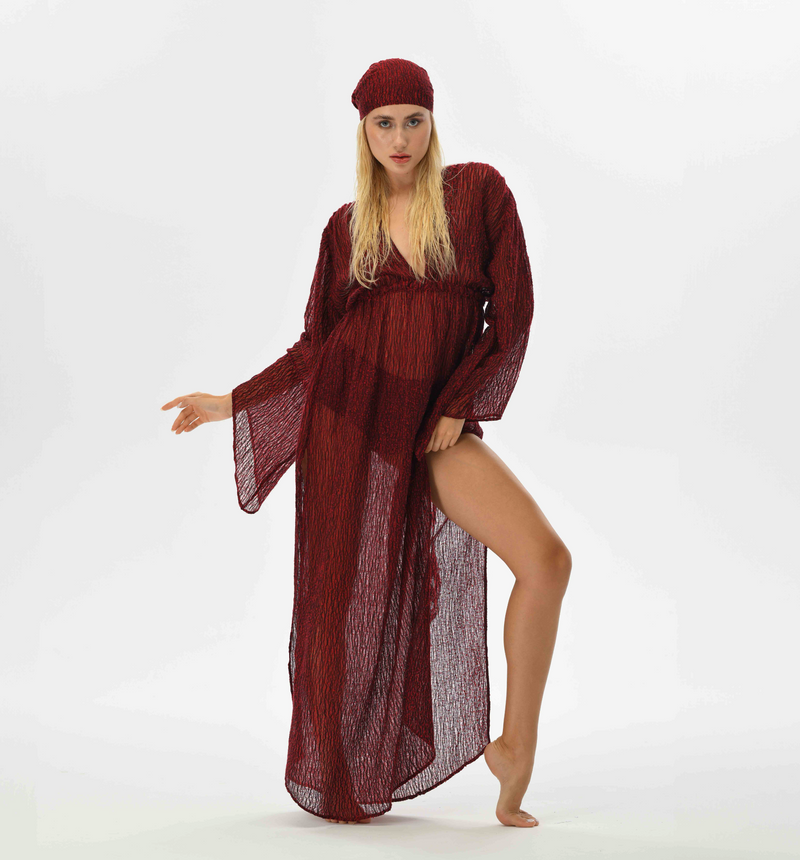 Bohemian red kaftan dress with fairy sleeves and an elastic waist for a feminine silhouette. Made from handwoven Turkish fabric, featuring a see-through, flowy design, perfect for special occasions.