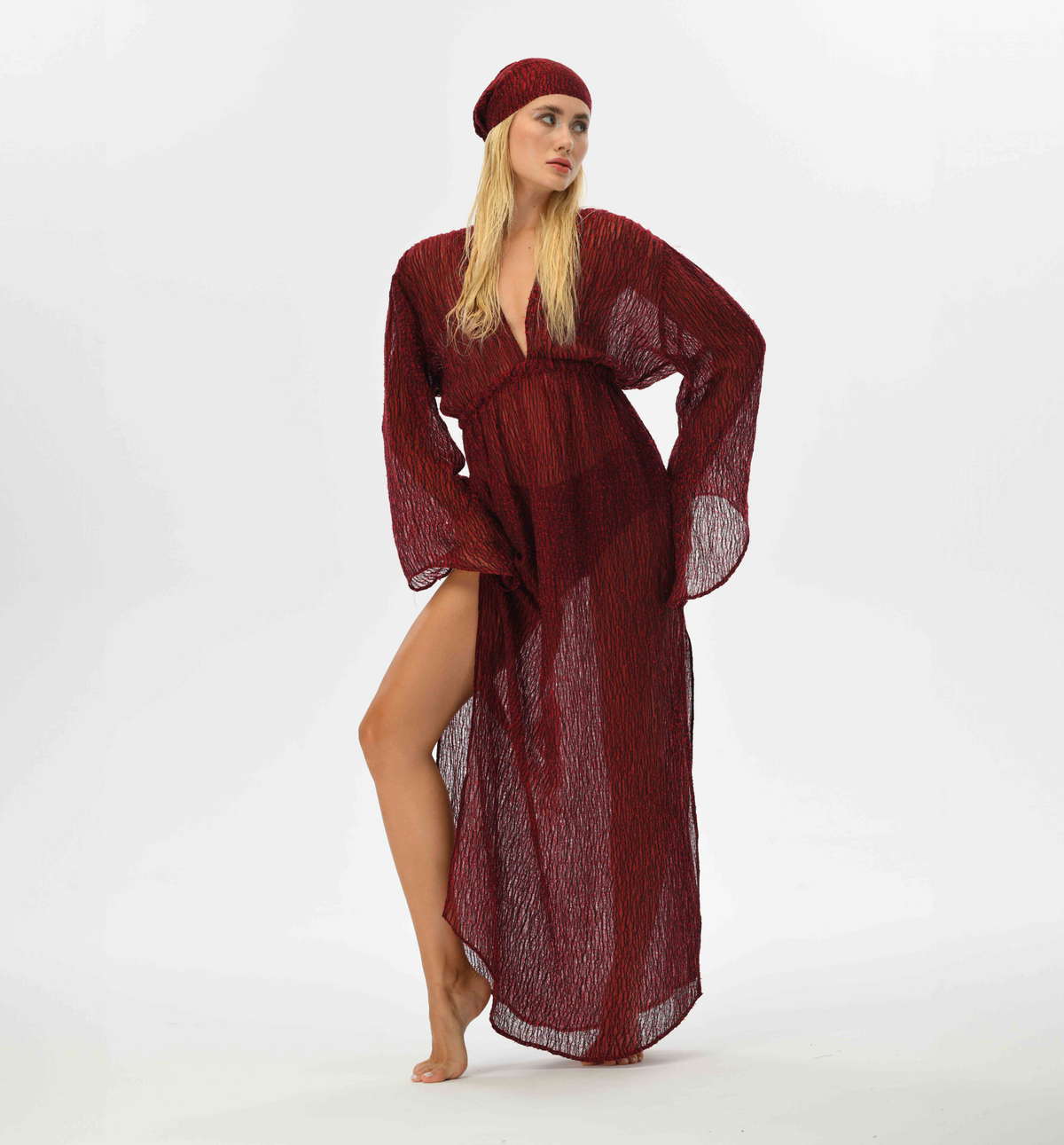 Handwoven Turkish fabric kaftan in red and black, featuring long fairy sleeves and a see-through design. Perfect for goddess-inspired outfits, with an elastic waist for added femininity.