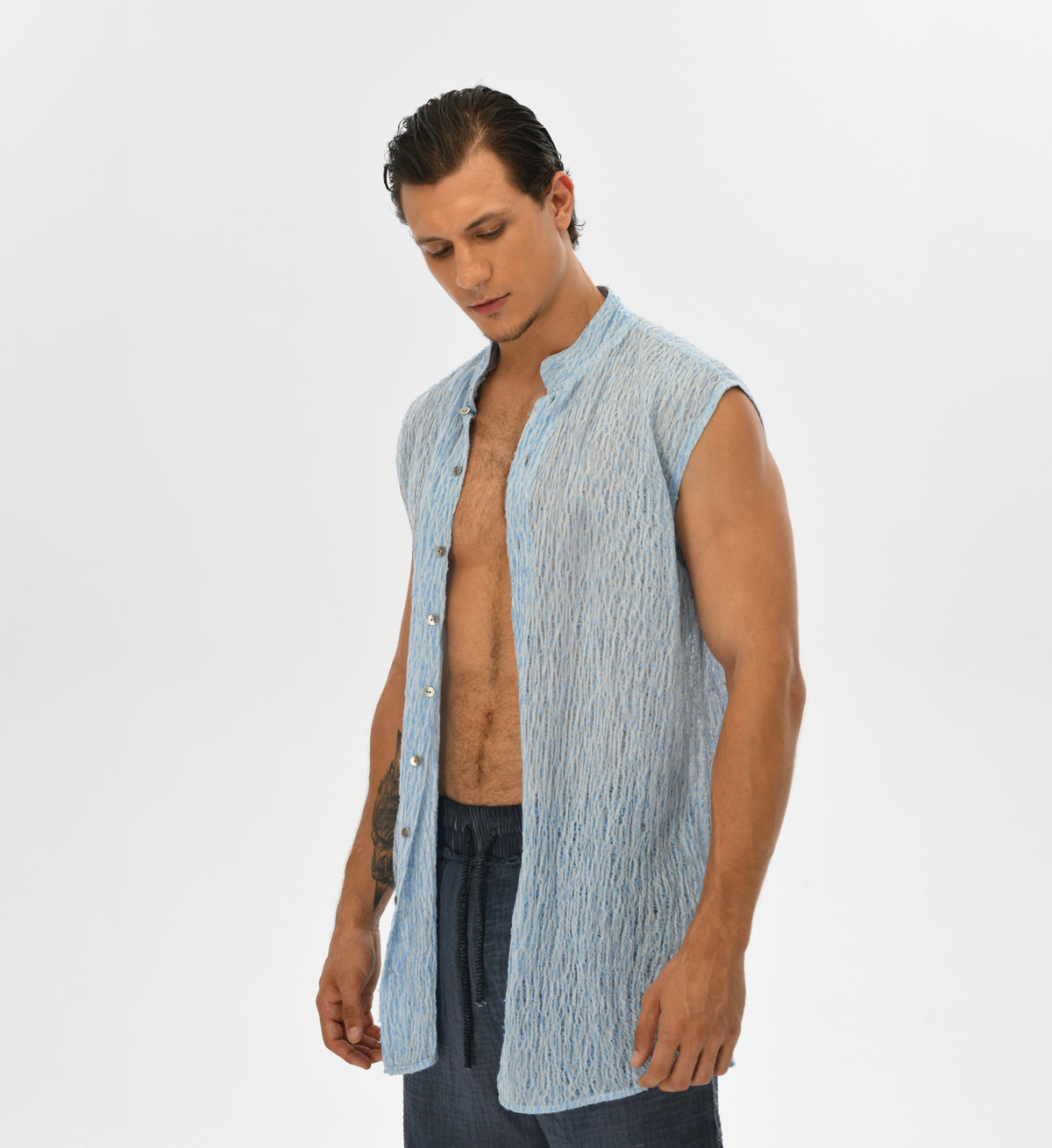 Unisex vest made from handwoven Turkish cotton in blue and white. This relaxed-fit layering piece is perfect for festival fashion, resort wear, or casual day-to-day outfits, reflecting the calm and fluidity of water elements.