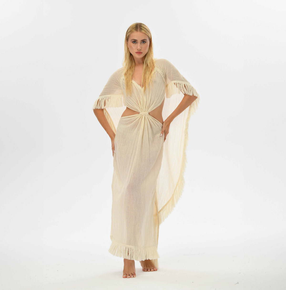 Handwoven sheer cotton kaftan with a flowy cape and open back design, perfect for capturing boho goddess vibes.