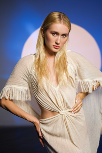 Handwoven sheer cotton kaftan with a flowy cape and open back design, perfect for capturing boho goddess vibes.