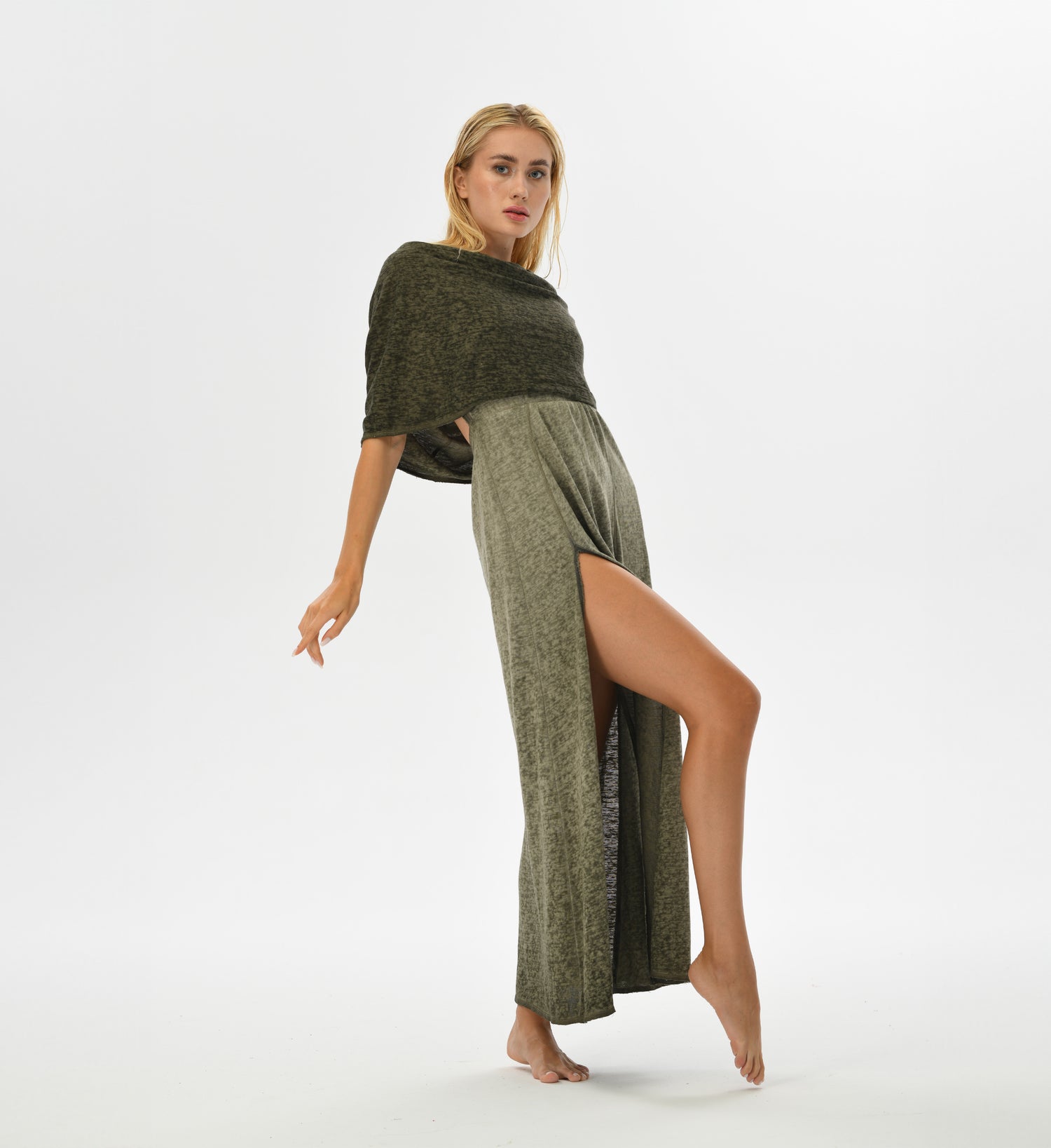 Boho festival dress in khaki green with an open back, high splits, and a versatile hood that can become a shawl. Hand-dyed with natural root dyes, made from a breathable cotton-linen blend.