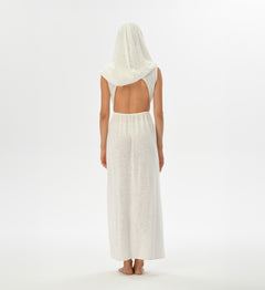 Boho festival dress in white with an open back, high splits, and a versatile hood that can become a shawl. Hand-dyed with natural root dyes, made from a breathable cotton-linen blend.