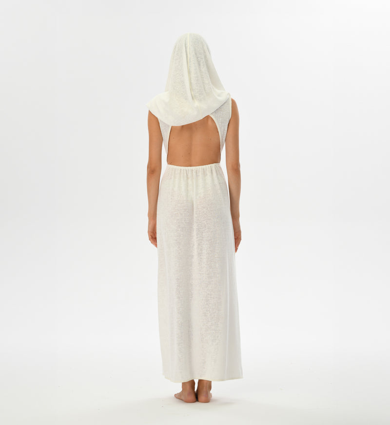 Boho festival dress in white with an open back, high splits, and a versatile hood that can become a shawl. Hand-dyed with natural root dyes, made from a breathable cotton-linen blend.