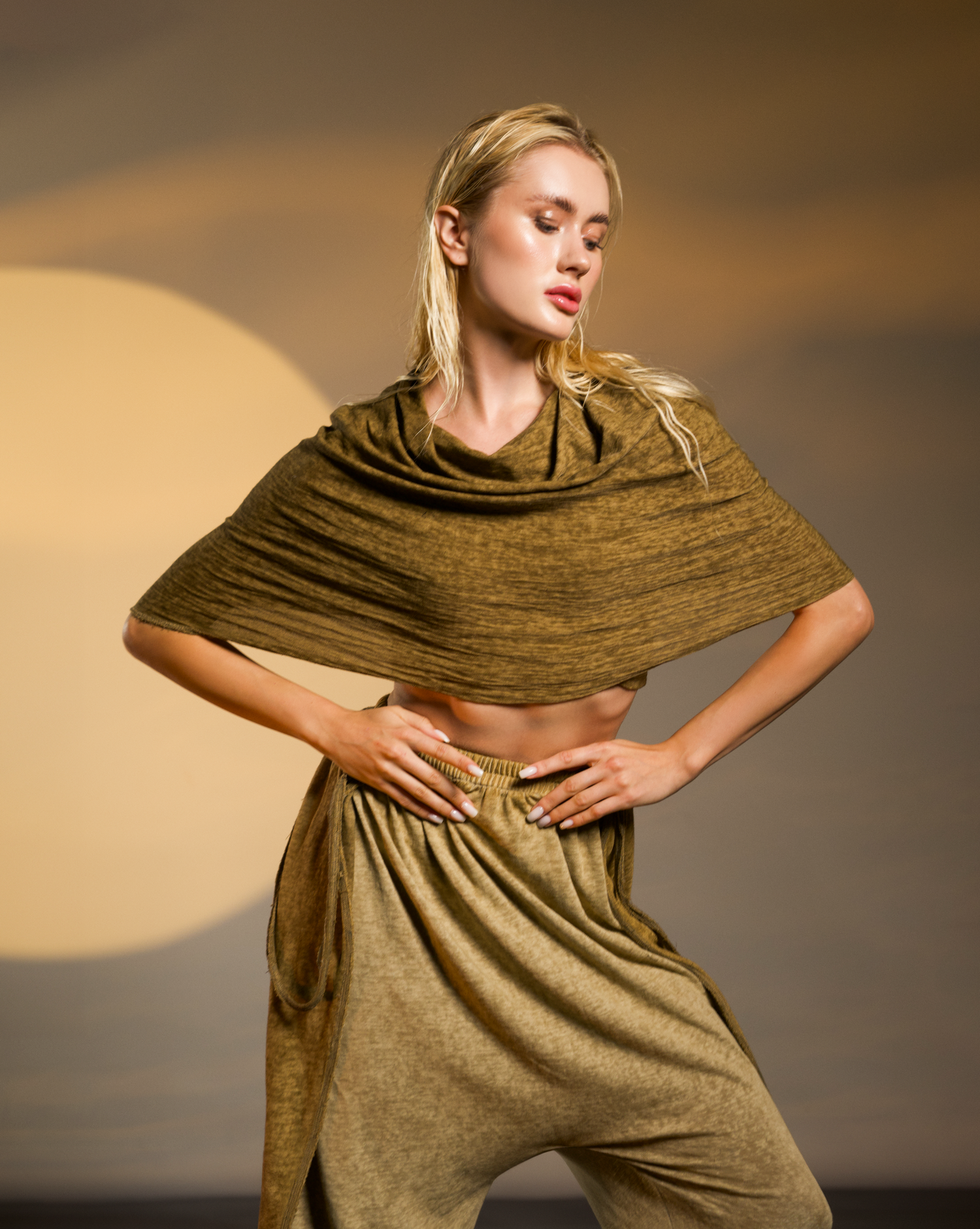 Linen cotton warrior blouse in desert sand, featuring an oversized hood that transforms into a shawl.