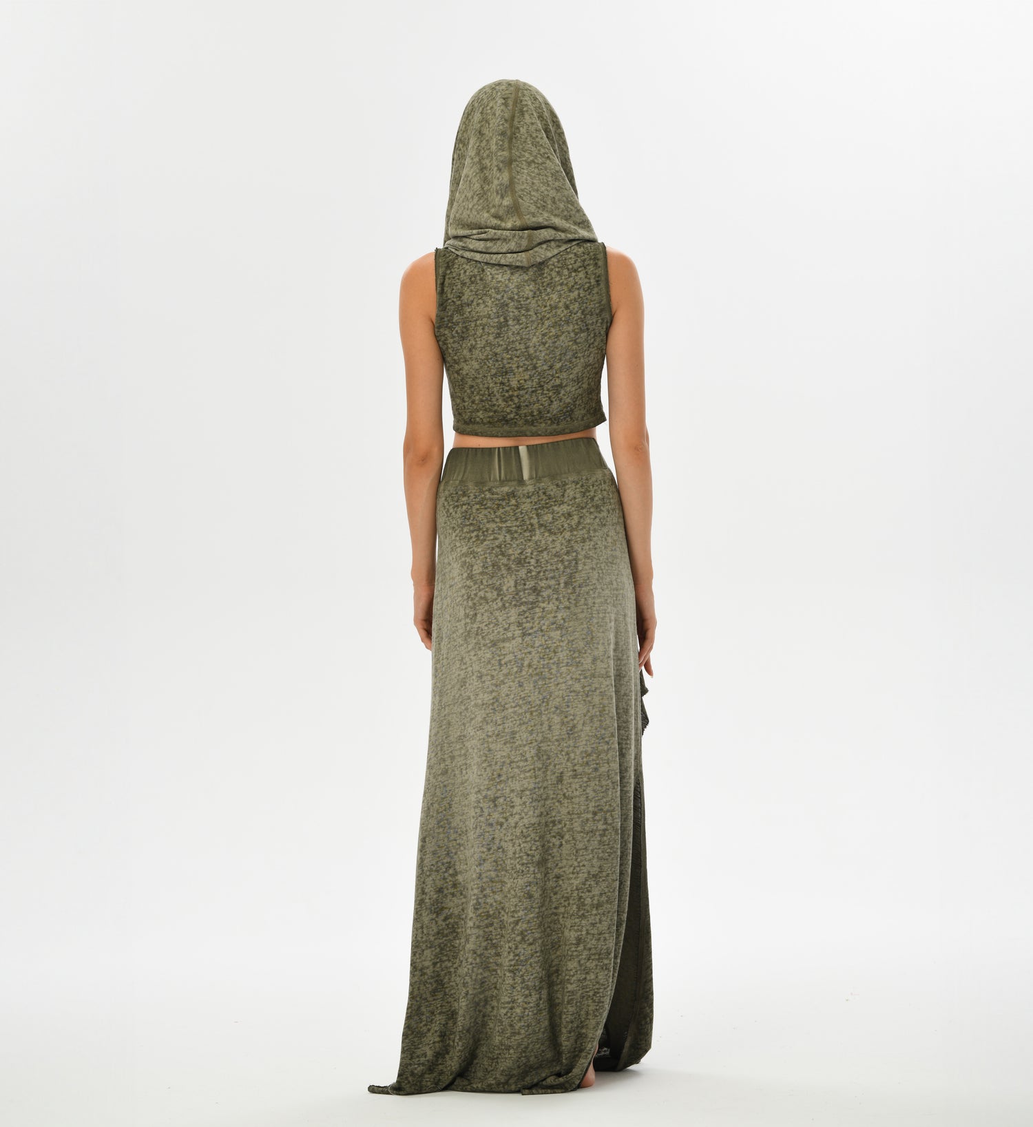 Boho chic hooded top in green with a convertible hood-to-shawl feature. Made from a linen-cotton blend for comfort and style, this top is perfect for casual outings and festivals.