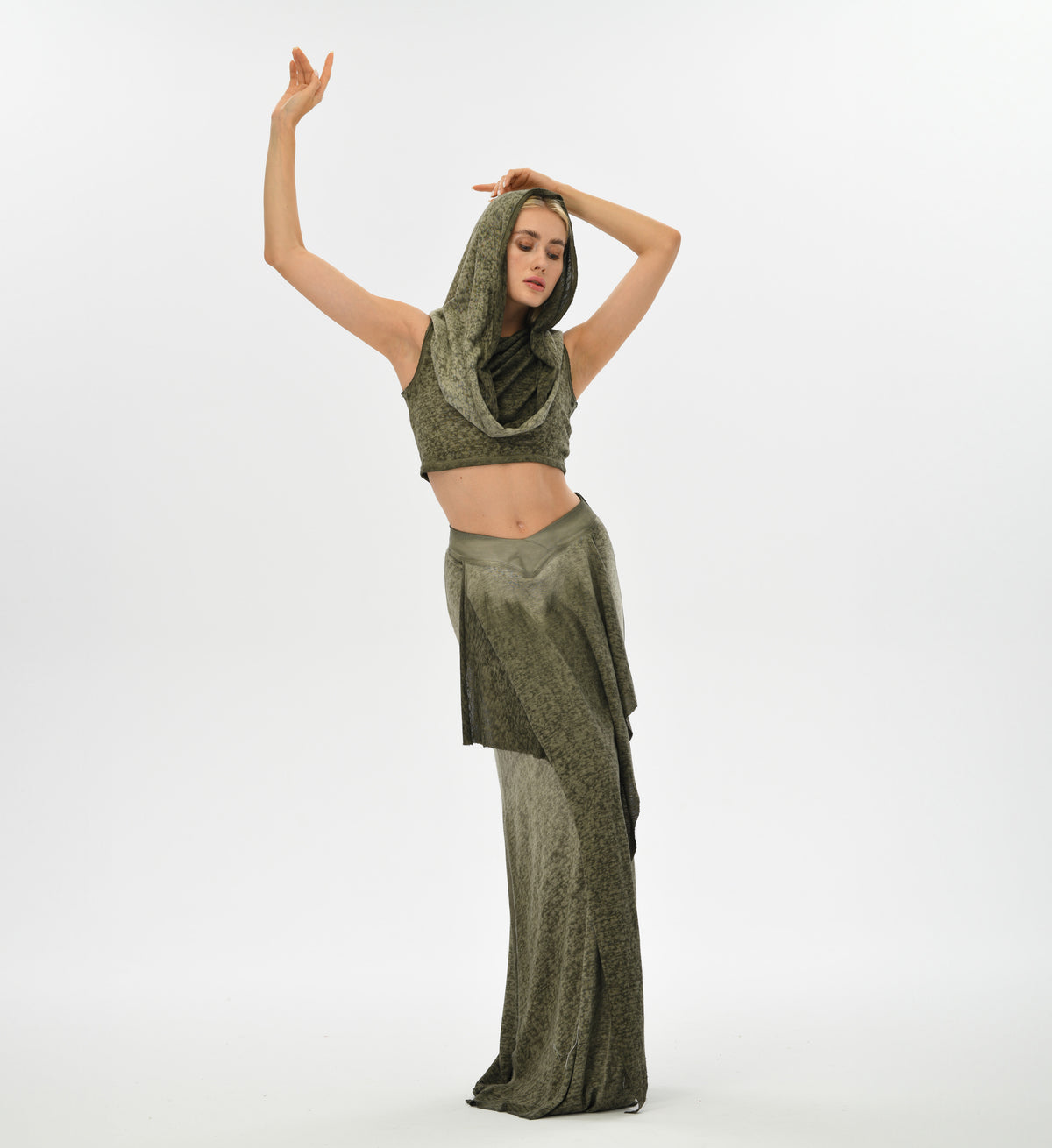 Green boho top with a hood that transforms into a shawl, crafted from linen and cotton for comfort and style. Perfect for festival wear or casual bohemian chic outfits.