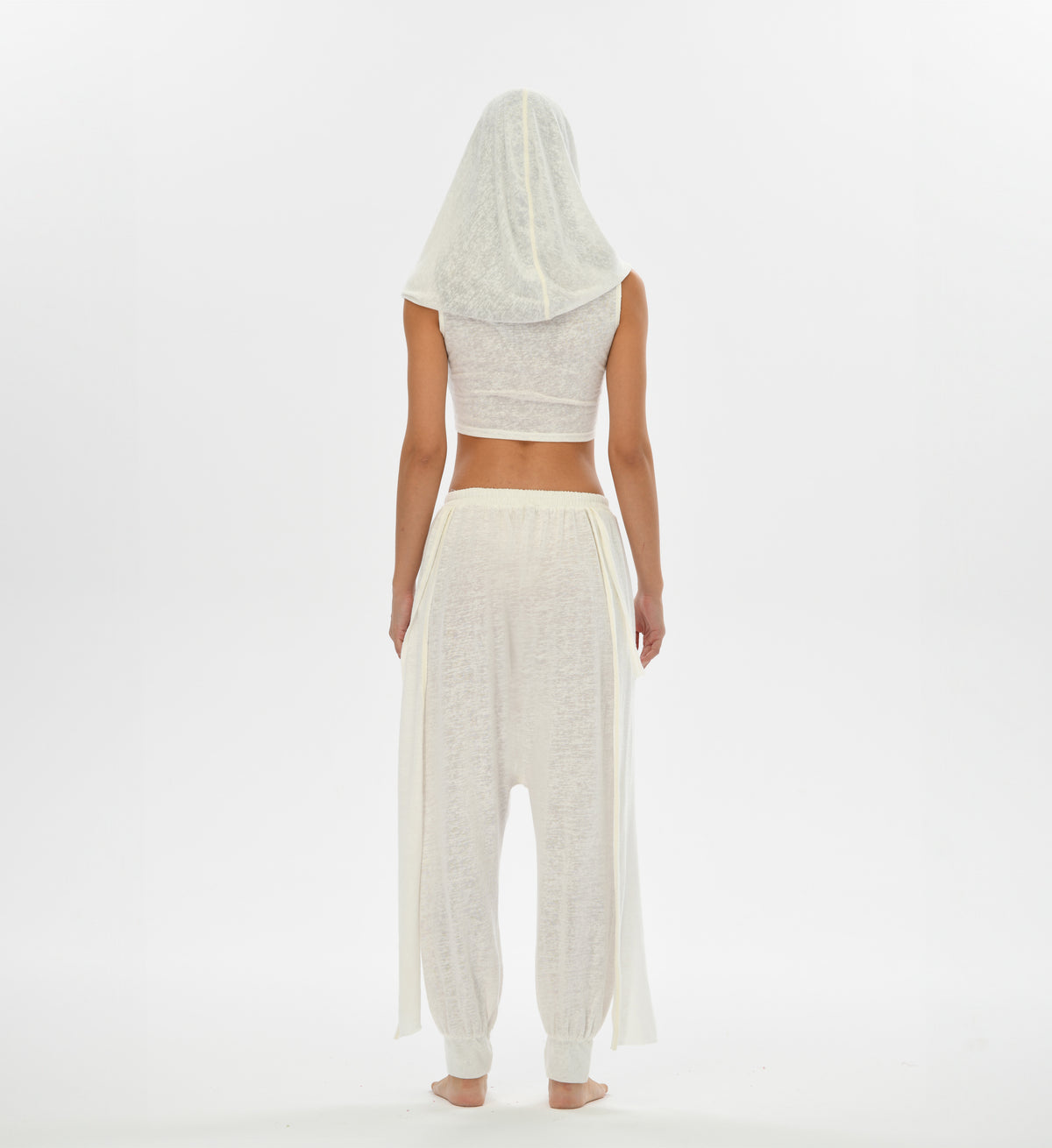 Mythical white hooded top with versatile oversized hood that can transform into a shawl, ideal for boho looks.