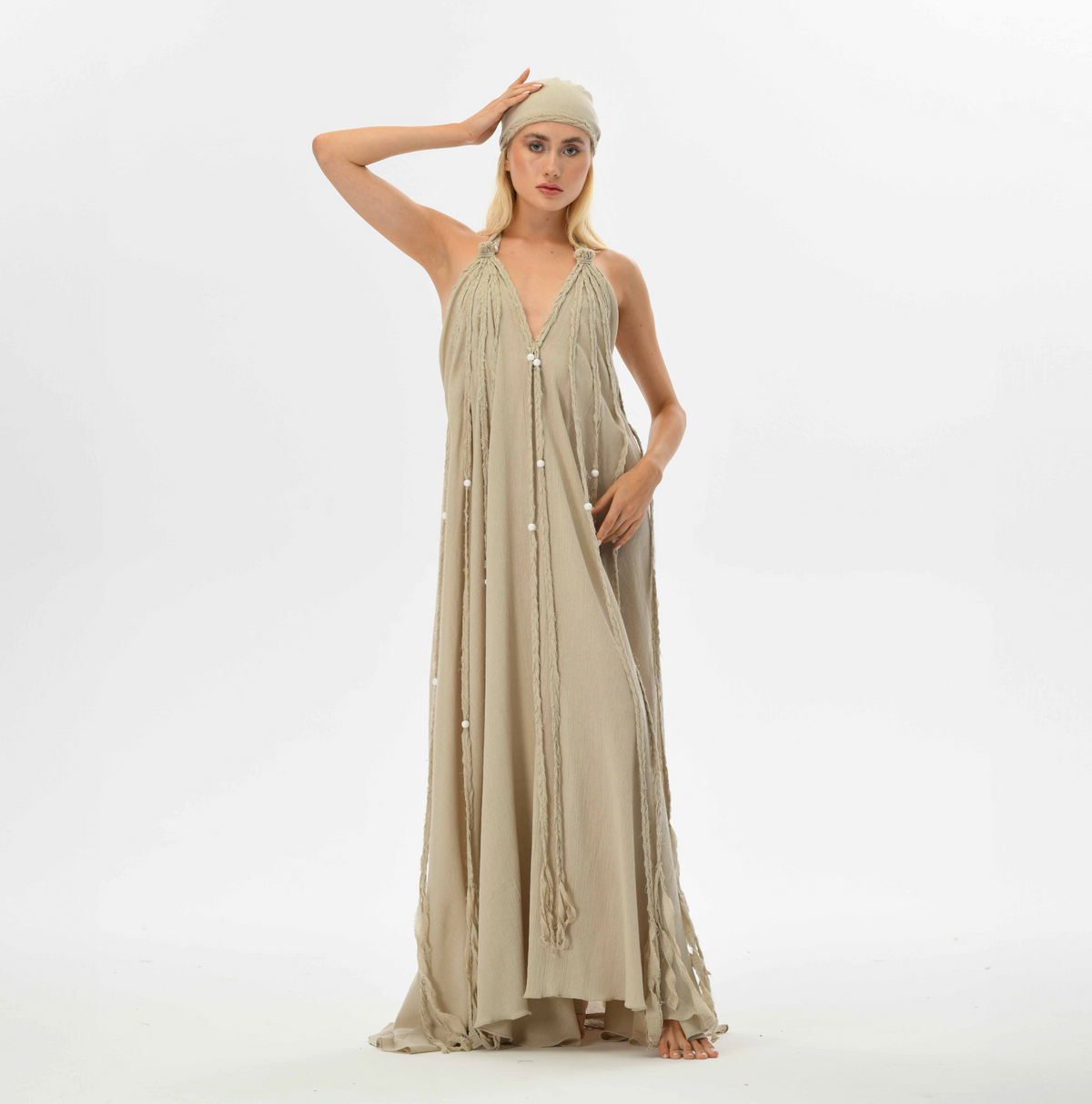 Gypsy goddess beige maxi dress with hand-braided embellishments. Boho chic design with open back, fits all sizes, ideal for summer festivals, weddings, or resort getaways.