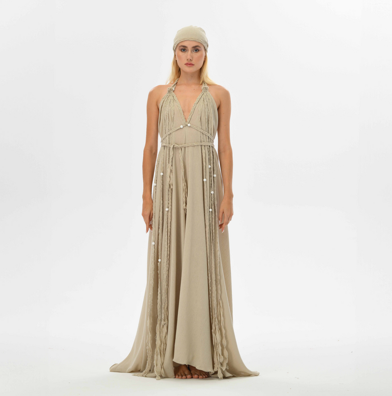 Bohemian beige maxi dress with an open back and hand-braided embellishments. Perfect for gypsy-inspired festival outfits, summer weddings, or casual resort wear.