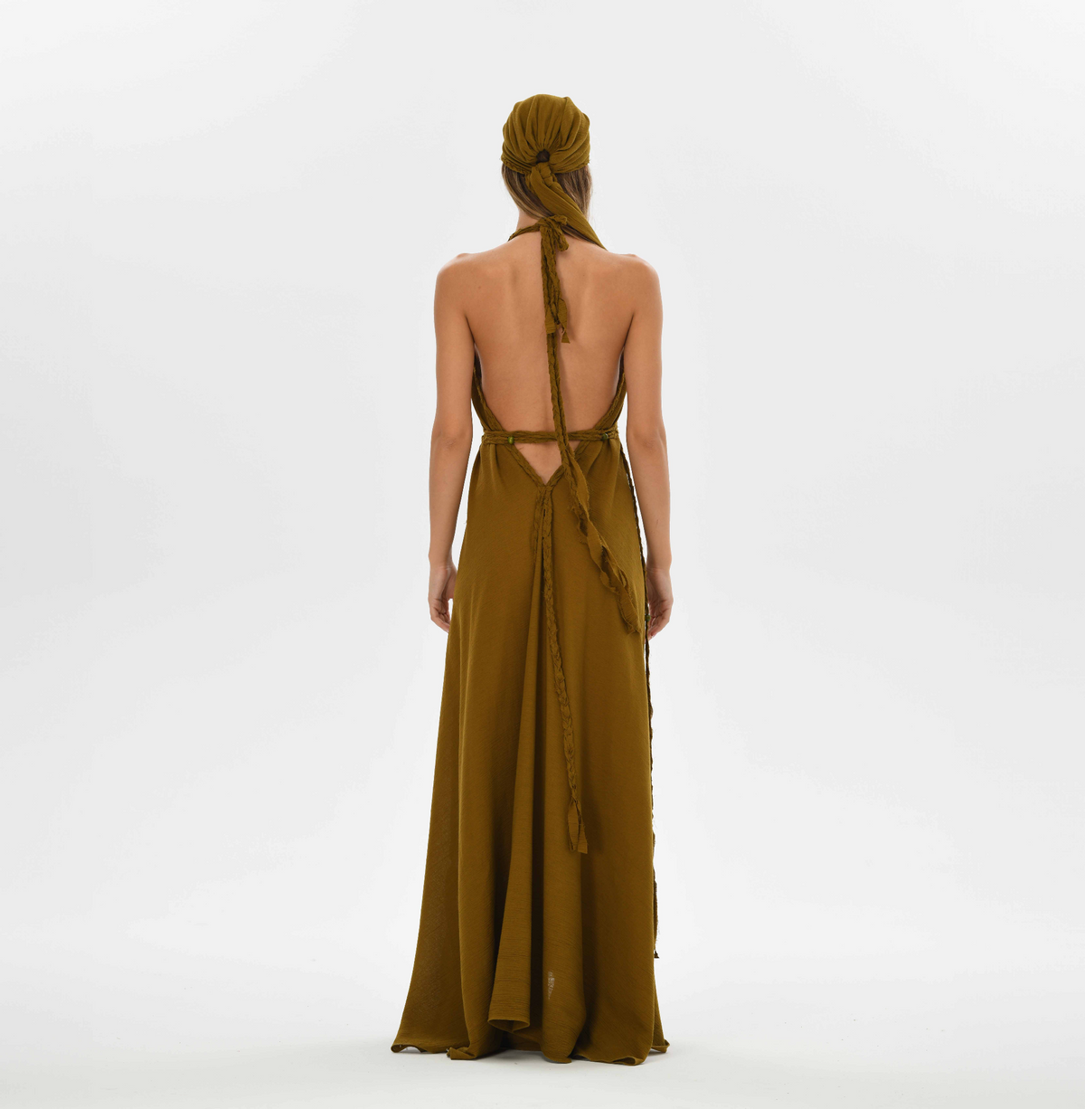 Boho chic brown maxi dress with a relaxed fit, hand-braided details, and open-back style. Ideal for weddings, festivals, and resort vacations.