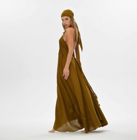 Hippie festival maxi dress in brown, featuring hand-braided embellishments and an open back. Perfect for beach weddings, summer events, or resort wear.