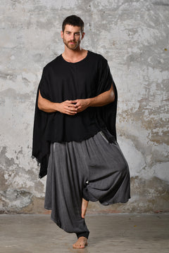 An enchanting Bohemian black poncho blouse unisex, perfect for boho and festival-inspired looks, exuding a goddess-like quality. black bohemian style perfect for Burning Man and other occasions. Menswear Boho Shirt. Boho sleeveless poncho unisex yogi