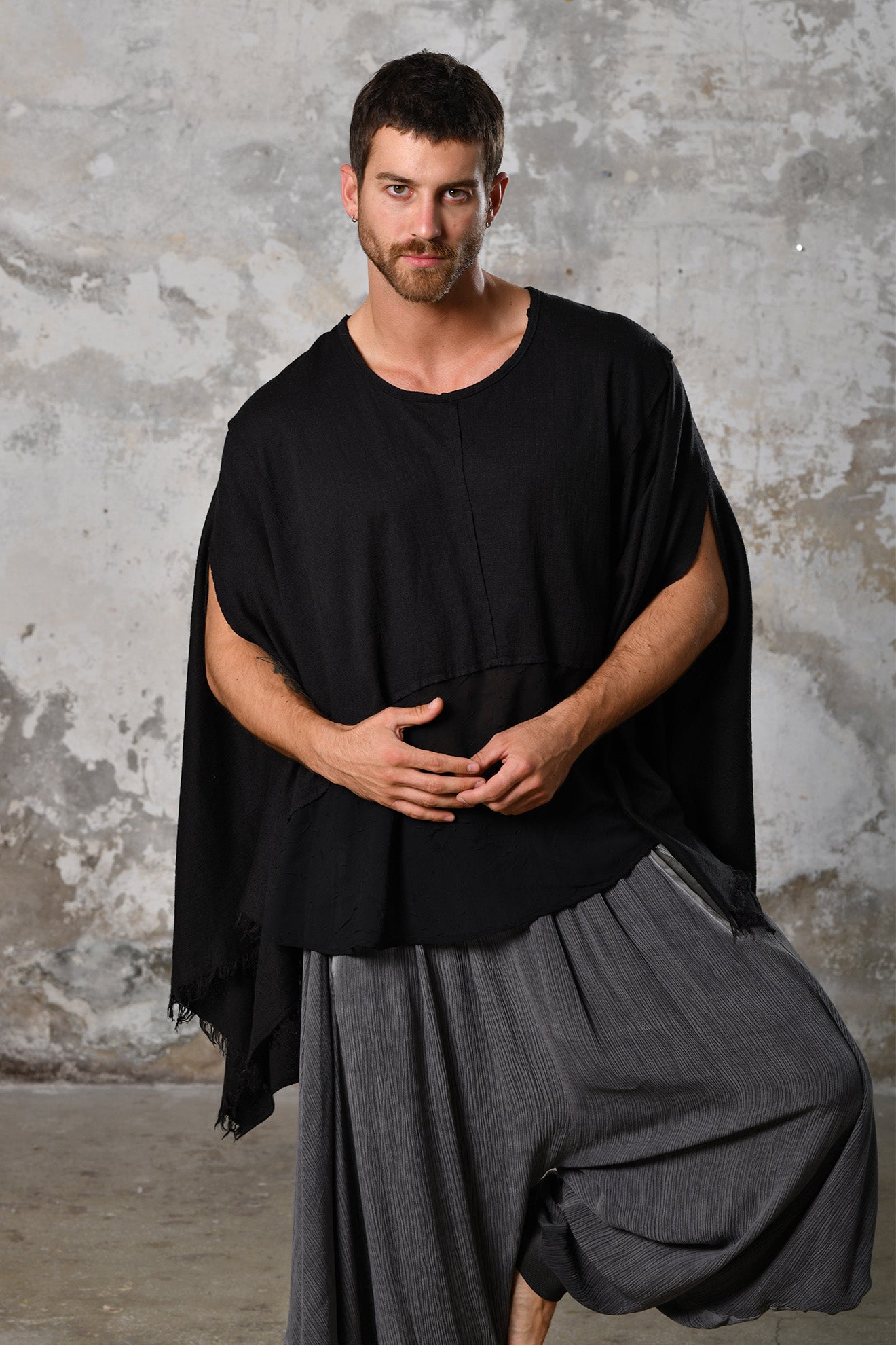 An enchanting Bohemian black poncho blouse unisex, perfect for boho and festival-inspired looks, exuding a goddess-like quality. black bohemian style perfect for Burning Man and other occasions. Menswear Boho Shirt. Boho sleeveless poncho unisex yogi