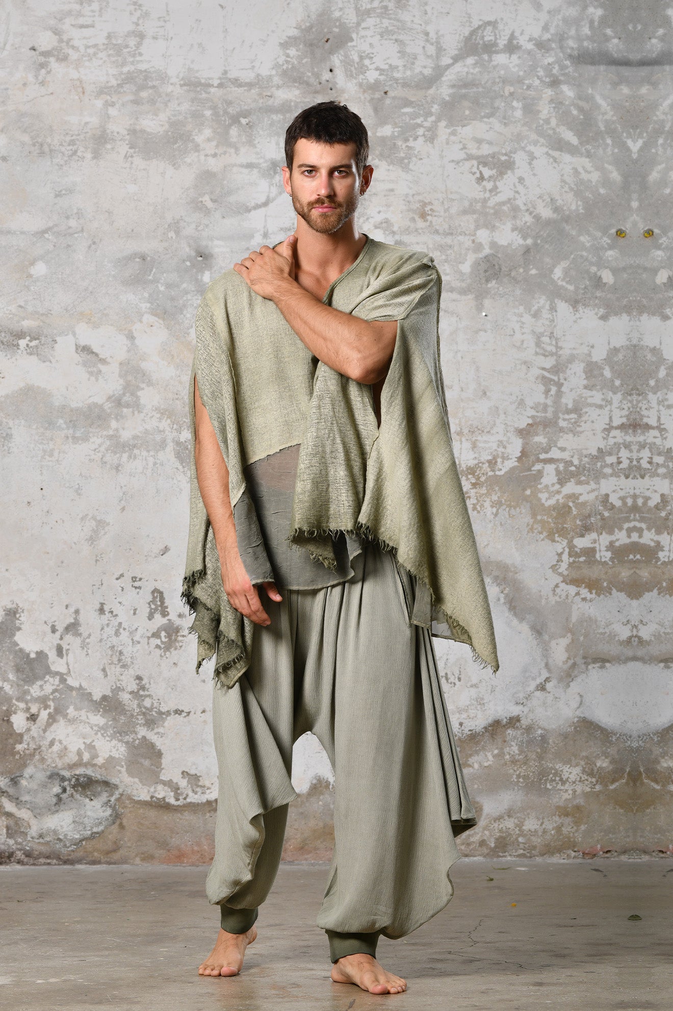 An enchanting Bohemian Leila, perfect for boho and festival-inspired looks, exuding a goddess-like quality. Green bohemian style perfect for Burning Man and other occasions. Menswear Boho Shirt. Boho sleeveless poncho unisex