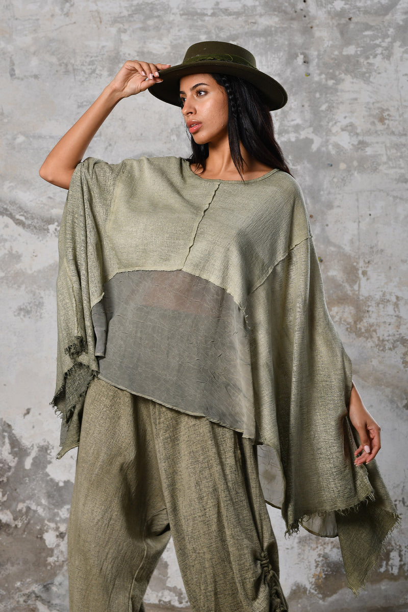 An enchanting Bohemian Leila, perfect for boho and festival-inspired looks, exuding a goddess-like quality. Green bohemian style perfect for Burning Man and other occasions. Menswear Boho Shirt. Boho sleeveless poncho unisex