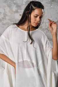 An enchanting Bohemian Leila, perfect for boho and festival-inspired looks, exuding a goddess-like quality. The flowy fabric and intricate side details create an ethereal, bohemian style perfect for Burning Man and other occasions. This garment is an ethically crafted gem. Menswear Boho Shirt. Boho sleeveless poncho unisex