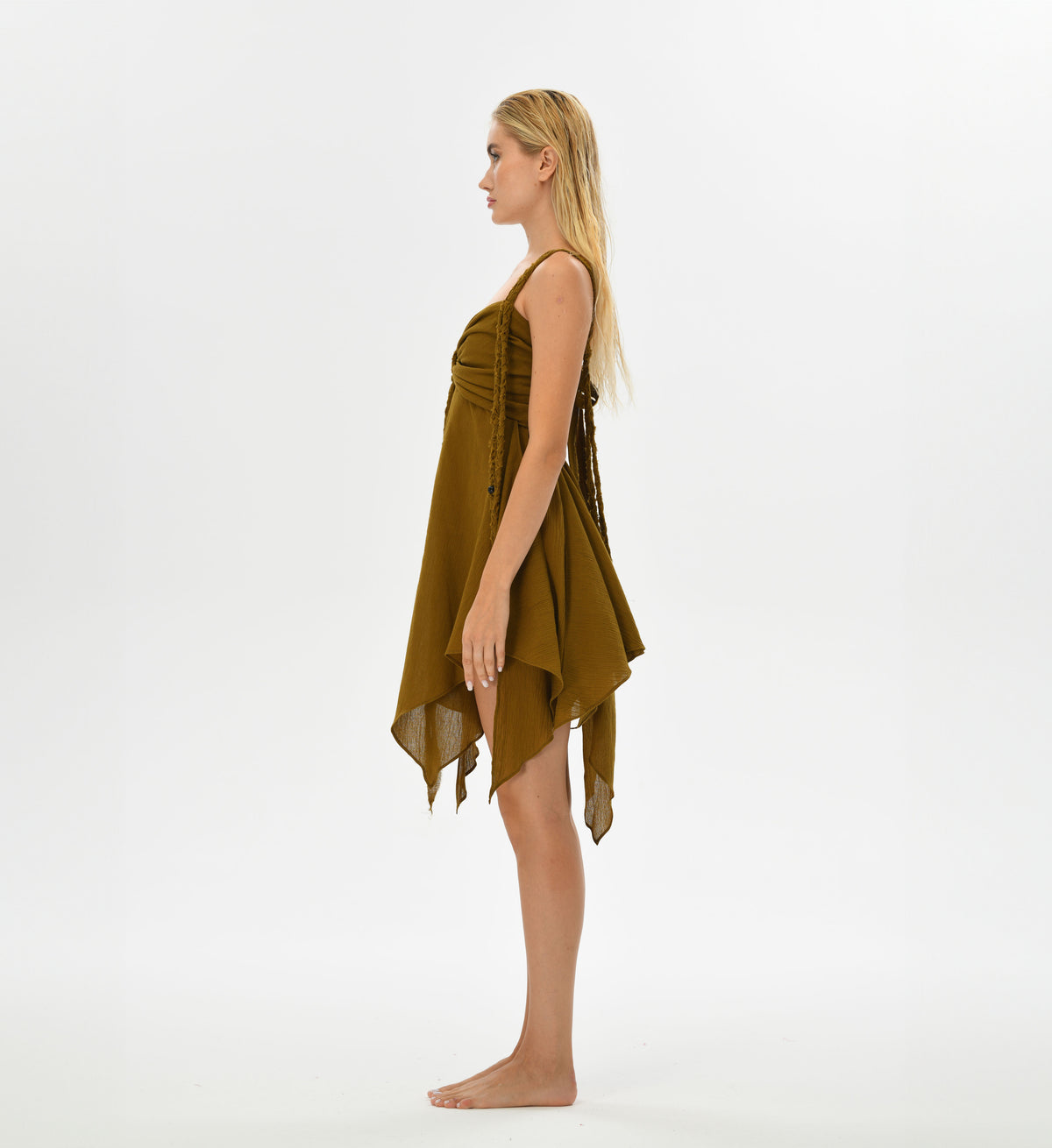 Bohemian brown mini dress crafted from Turkish cotton with intricate hand-braided threads. Features an adjustable back and a flowing skirt, perfect for festivals and casual wear, embodying a fairy-inspired, boho-chic style.