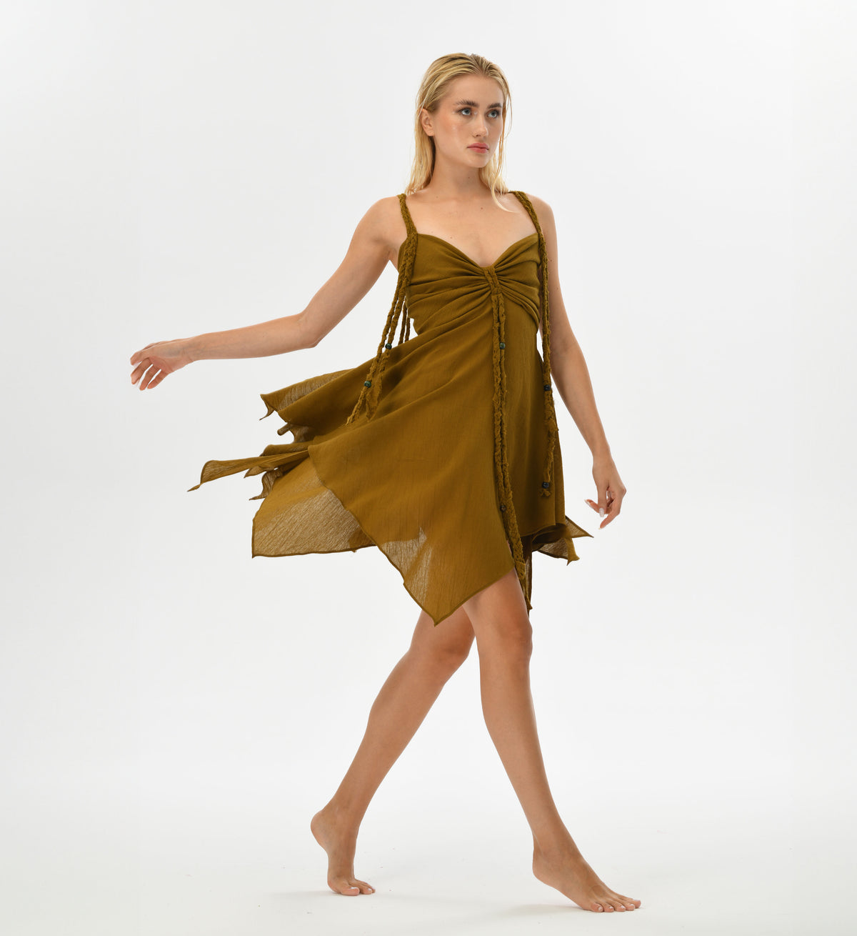 Bohemian brown mini dress made from 100% Turkish cotton, featuring a flowing skirt and hand-braided details. The adjustable back provides a customizable fit, perfect for a whimsical, fairy-inspired look at festivals or casual outings.