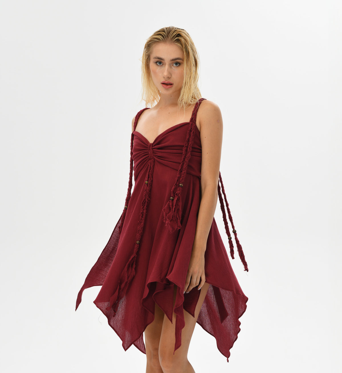 Mini Dress in soft, ethereal shades, featuring a corset-like top and hand-braided embellishments. Crafted from Turkish cotton, the adjustable back ensures comfort and a graceful fit for a boho-chic look with fairy-inspired magic.