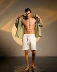 Beige men’s shorts in a boho style, crafted from soft muslin cotton for casual wear, festivals, or beach days.