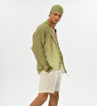 Men’s boho chic beige shorts, made from breathable muslin Turkish cotton for relaxed summer comfort.