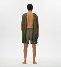 Men’s green shorts with a flowy, relaxed fit, made from breathable muslin Turkish cotton, perfect for summer.