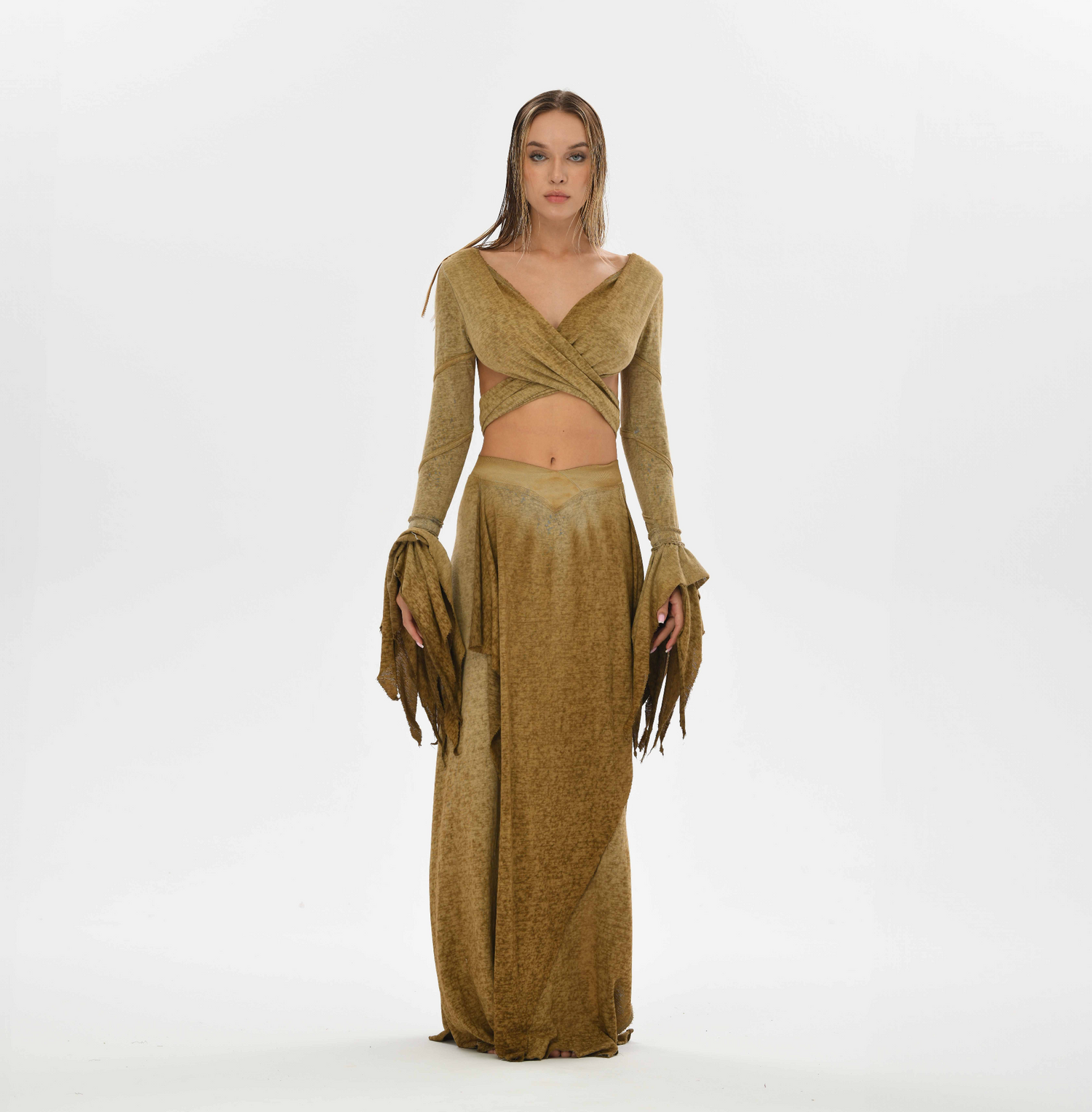 Gypsy style desert sand skirt with a goddess cut, ideal for layering in tribal fusion and boho chic outfits. Elastic waistband and side splits provide comfort and flexibility for sizes XS to L.