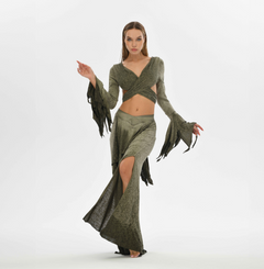 Green boho skirt with side splits, crafted from a cotton-linen blend with an elastic waistband. Can be worn high or low waisted, fitting sizes XS to L, ideal for bohemian or oriental-inspired fashion.