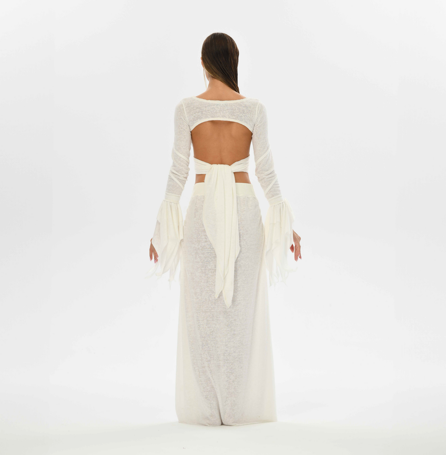 White oriental skirt made from a cotton and linen blend, featuring a goddess cut, side splits, and an elastic waistband for sizes XS to L. Perfect for tribal fusion, belly dance, and boho chic outfits.