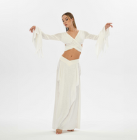 Gypsy style white skirt with a goddess cut, ideal for layering in tribal fusion and boho chic outfits. Elastic waistband and side splits provide comfort and flexibility for sizes XS to L.