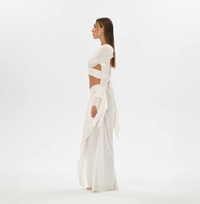 Nature-inspired tribal fusion skirt in white, made from cotton-linen blend with side splits and an elastic waistband. Perfect for belly dance, gypsy style, or casual bohemian looks.