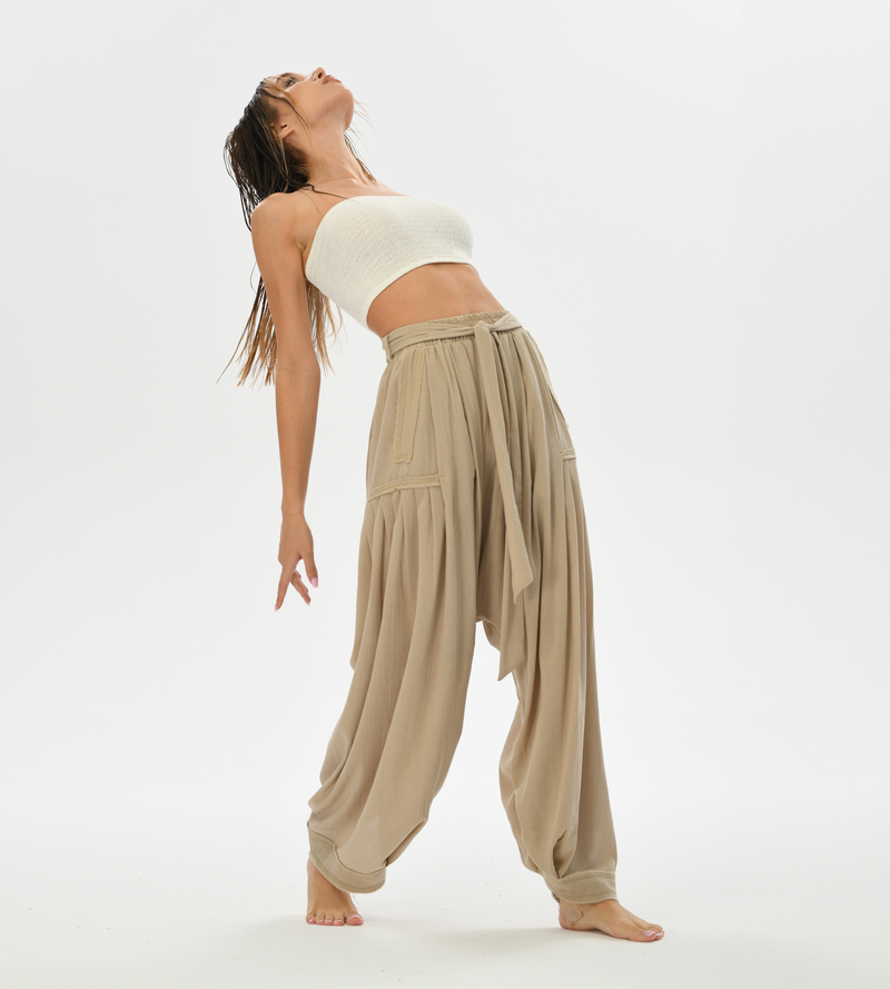 Loose fit beige harem pants for women, made from breathable cotton, ideal for casual boho wear or yoga.