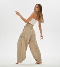 Bohemian-inspired beige pants with a harem cut, crafted from cotton for ultimate comfort, ideal for casual wear or yoga.