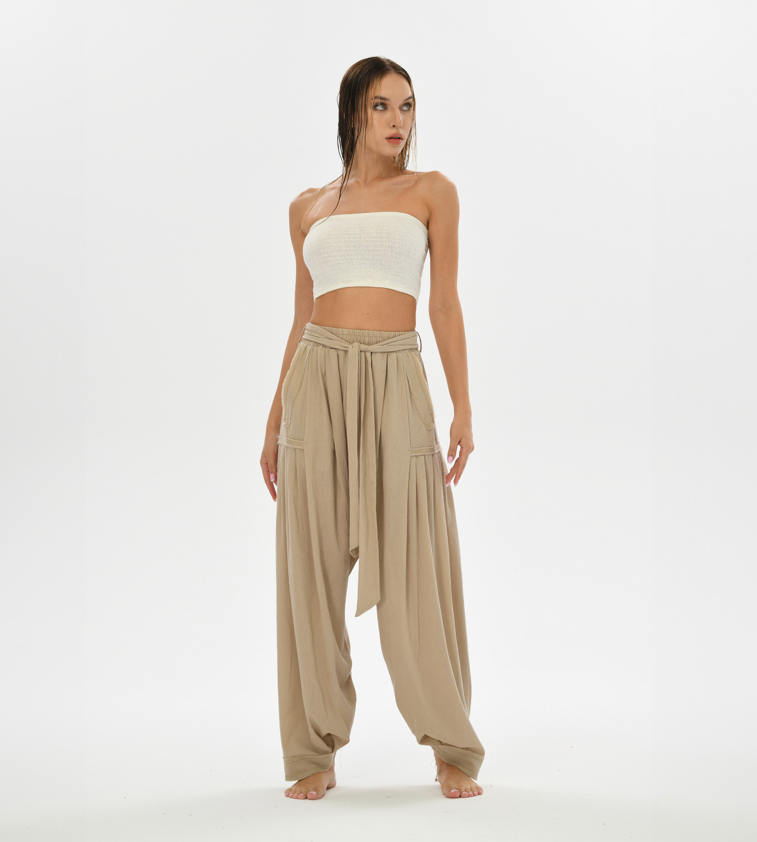 Women’s boho chic harem pants in beige, designed for comfort and style, crafted from soft cotton for a relaxed fit.