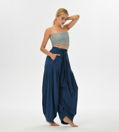 Women’s flowy harem pants in blue, designed with a relaxed fit and breathable cotton, perfect for lounging or boho chic fashion.