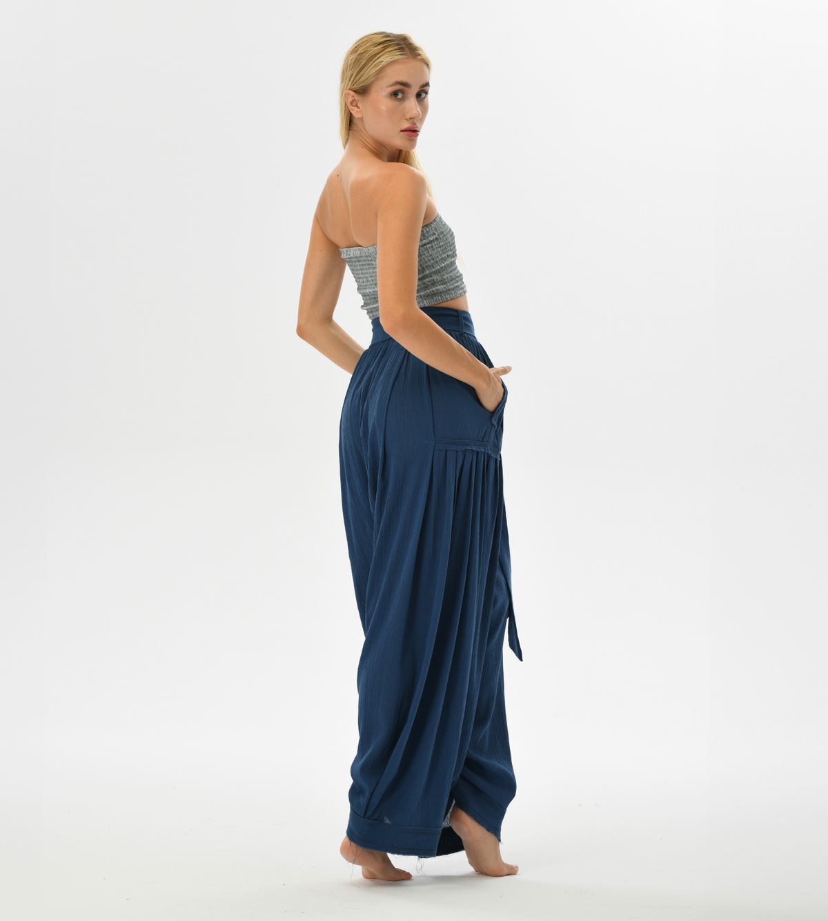 Women’s flowy harem pants in blue, designed with a relaxed fit and breathable cotton, perfect for lounging or boho chic fashion.