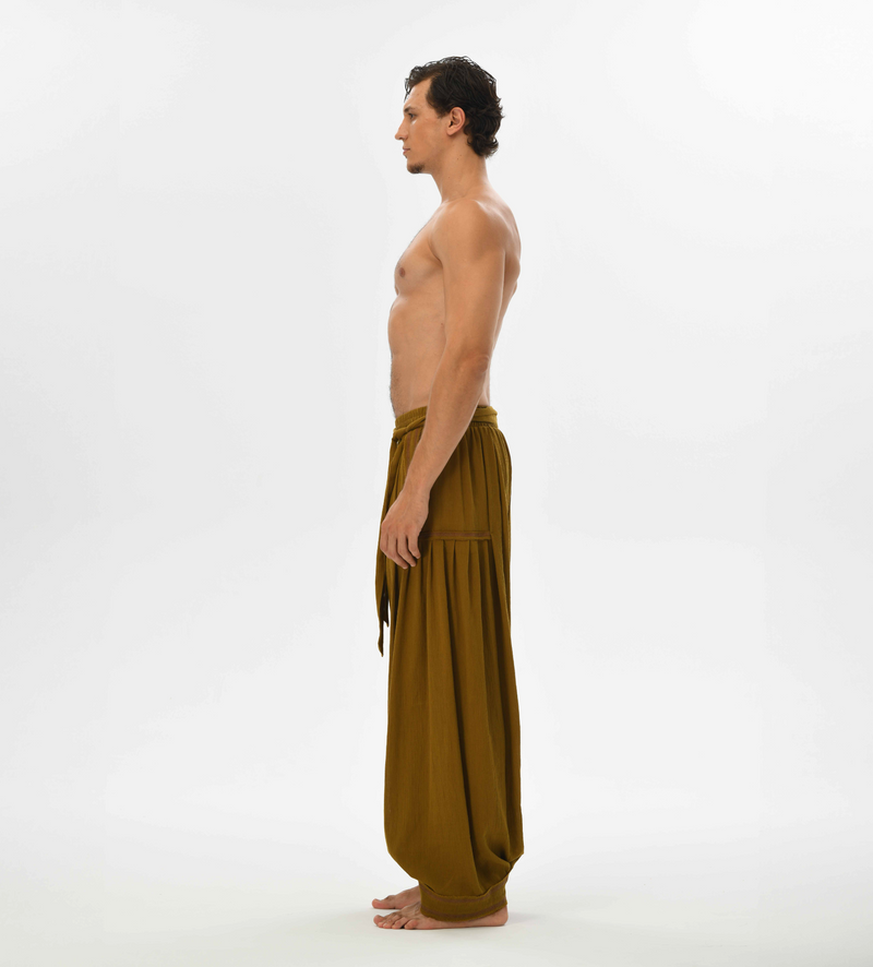 Earthy brown boho pants for men, designed with a harem cut and comfy cotton fabric, perfect for festivals and casual wear.