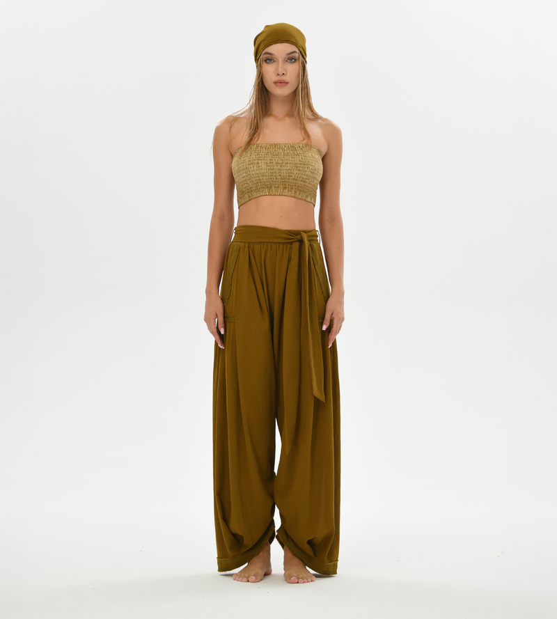 Comfy loose boho pants in brown, featuring a unique harem cut and breathable cotton fabric, ideal for casual wear and lounging.